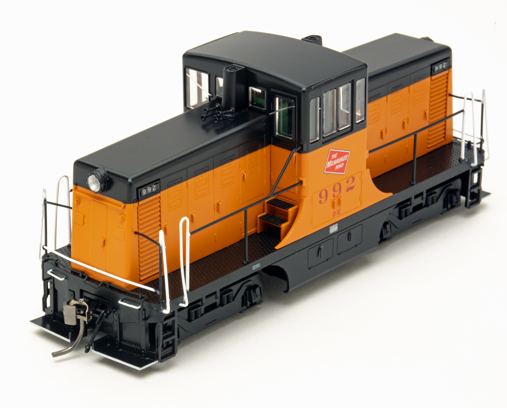 Color photo of orange and black switcher on white background.