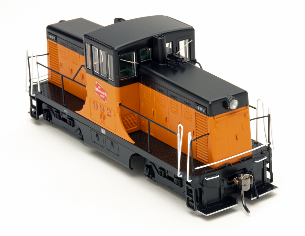 Orange and black HO switcher on white background.