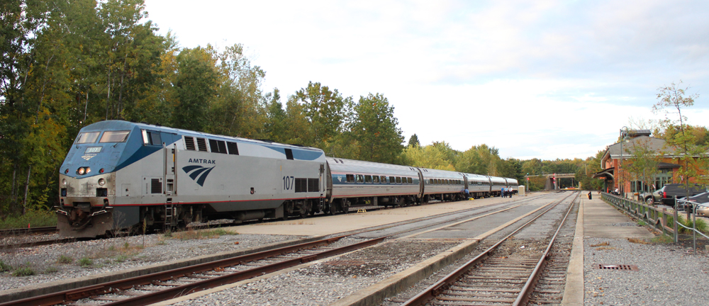 Passenger train at station with multiple tracks