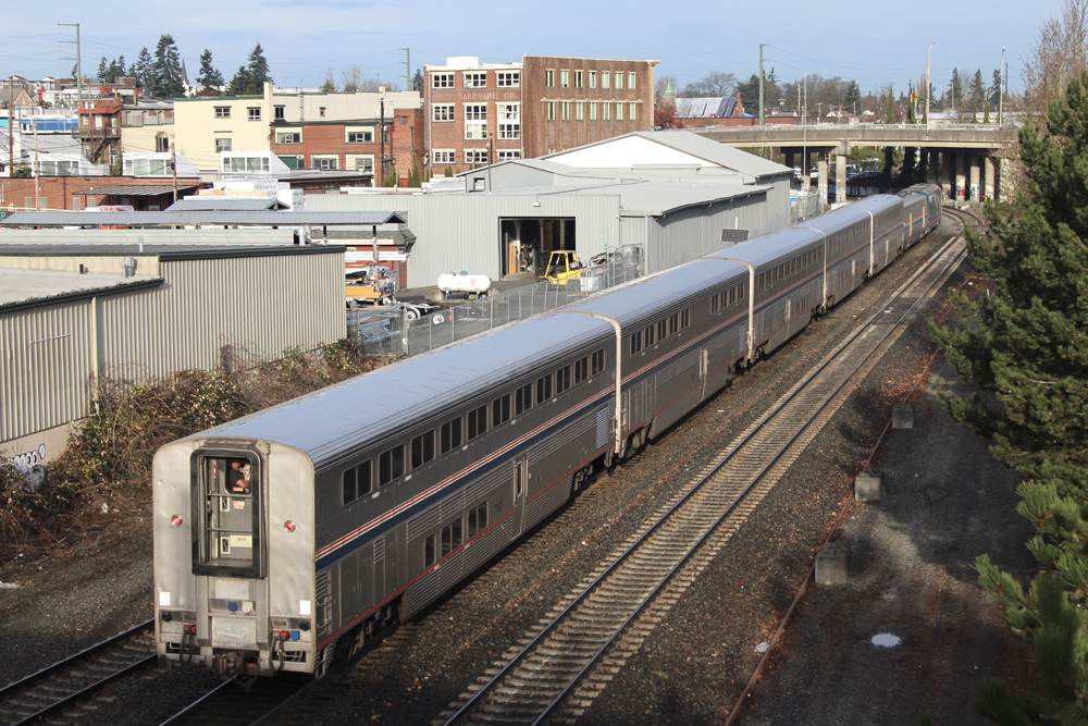 Going-away view of passenger train with bilevel equipment