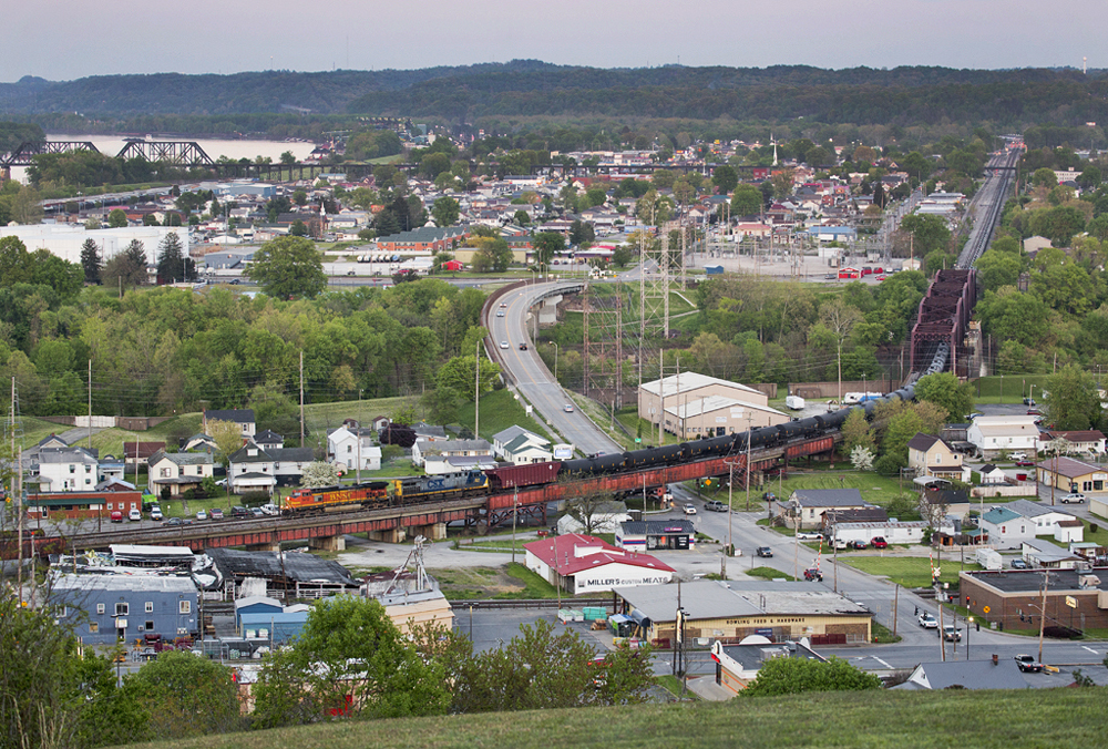 Train of tank cars crosses bridge