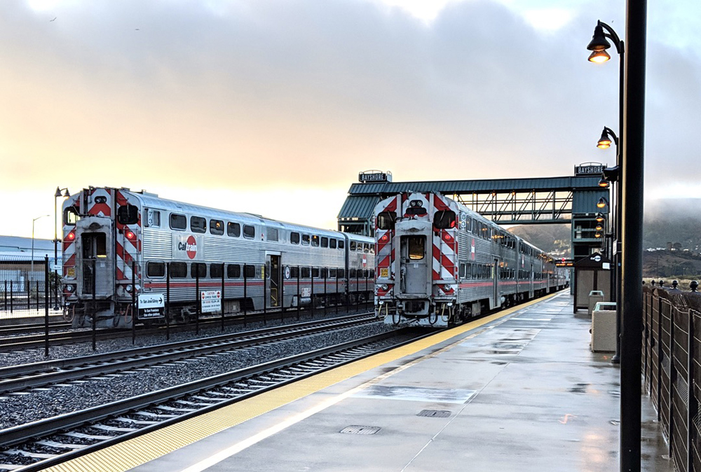 Two commuter trains await departure at station