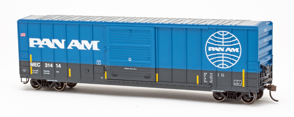 Photo of HO scale boxcar in blue and gray paint on white background.