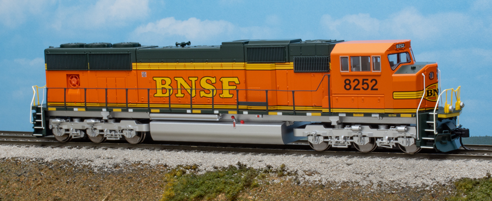 Color photo of HO scale diesel on scenic base.