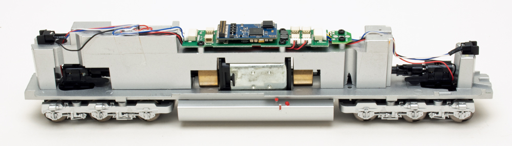 Color photo showing mechanism of HO scale diesel locomotive.