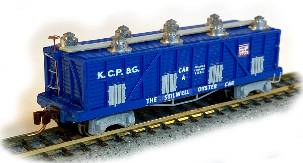 Color photo of N scale freight car painted blue with silver and gray details.