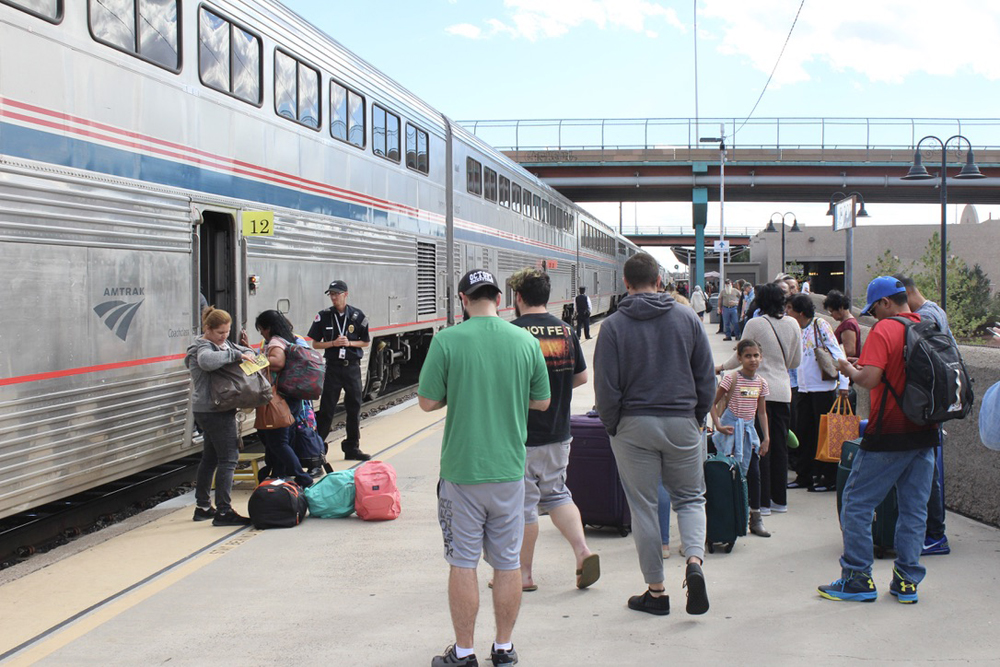 Passengers waiting on platform to board bilevel passenger equipment