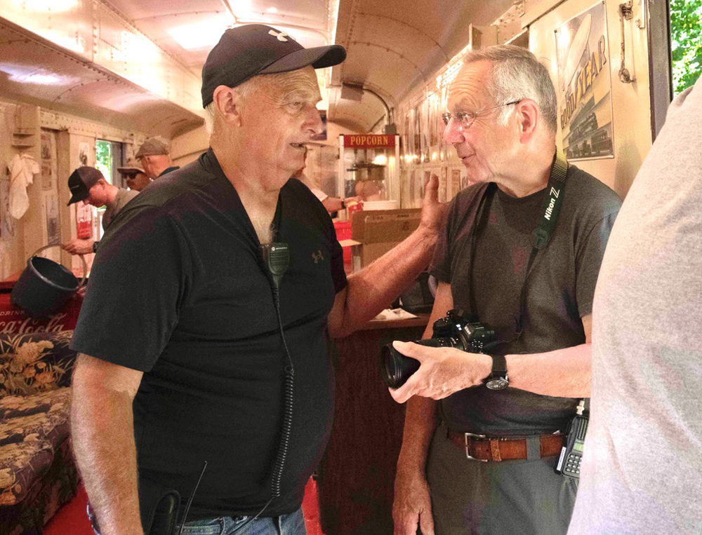 Two men talking in passenger car