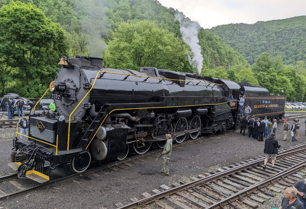 Steam locomotive being viewed by spectators