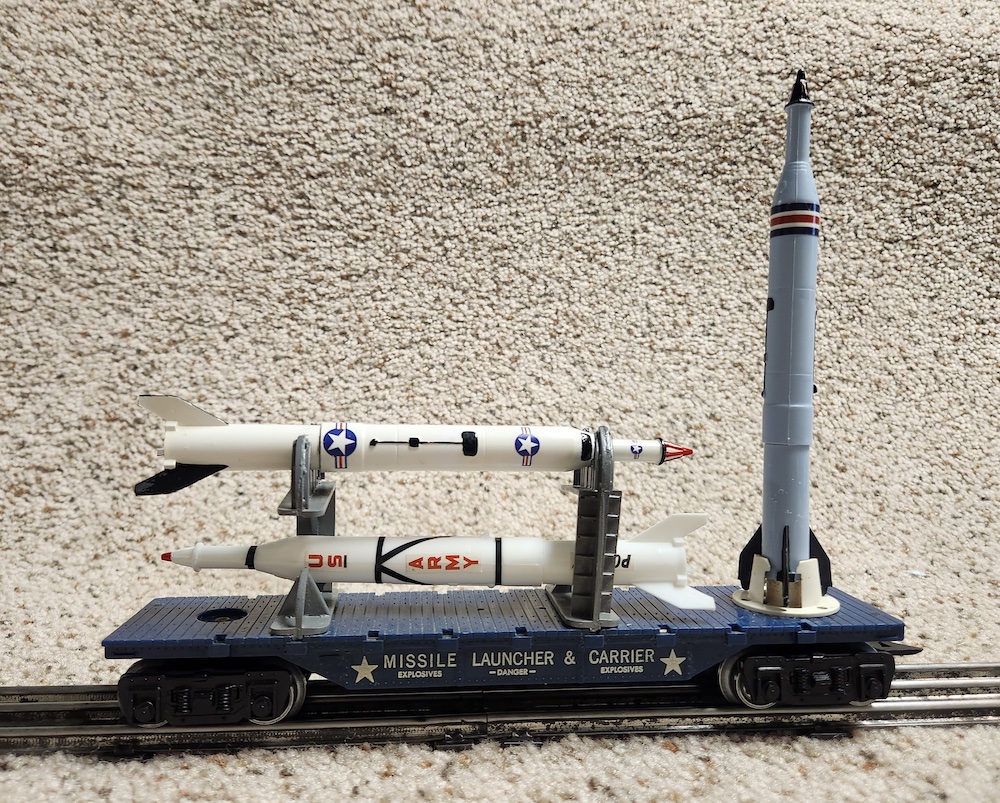 model flatcar with missiles and rocket on top