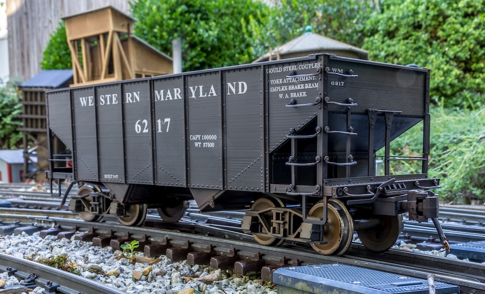 close up of model hopper car on garden railway