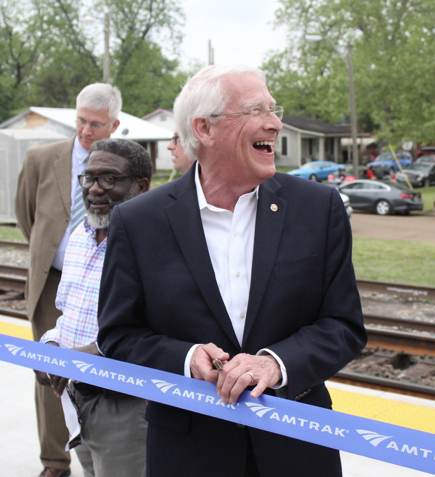 Laughing man at ribbon-cutting ceremony