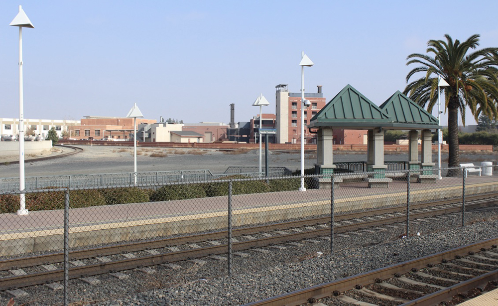 Double-track rail line with commuter station platforms