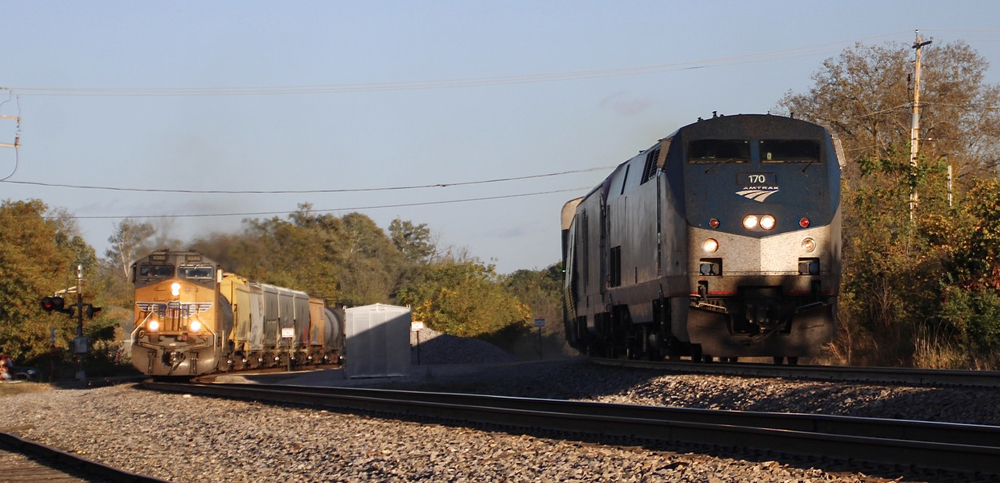 Passenger and freight trains side by side