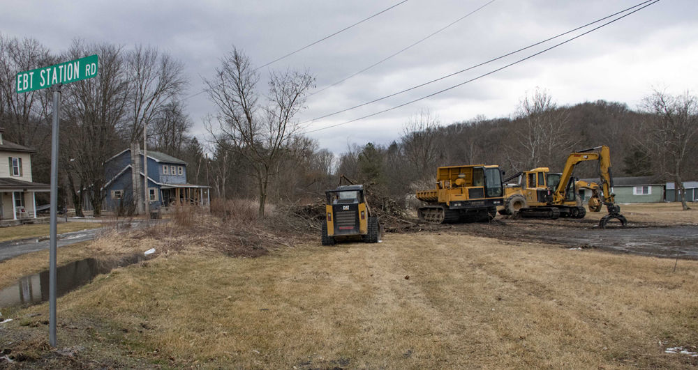 Earthmoving equipment on lot next to street sign for EBT Station Road