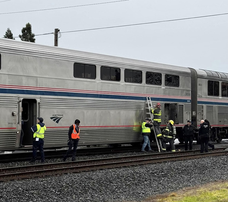 Firemen at bilevel passenger car