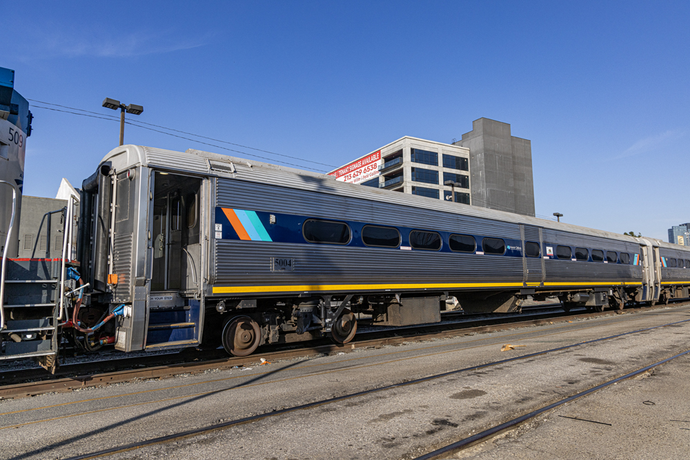 Three-quarters view of single-level, stainless steel passenger car