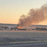 Burning containers at site of train derailment