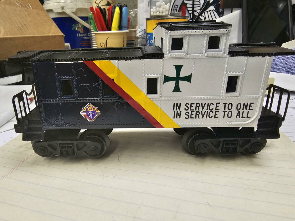 white, yellow, and black caboose mockup