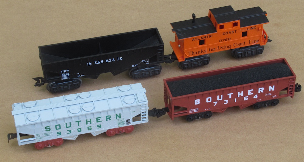 four pieces of Marx rolling stock