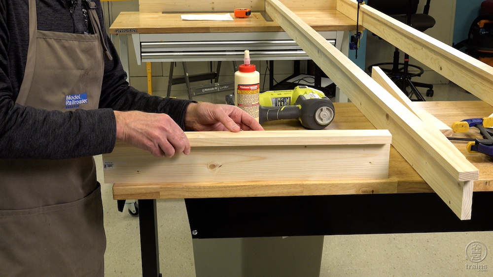 Two wood boards being glued together