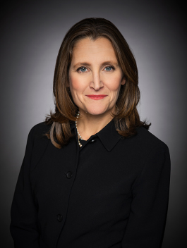 Head shot of woman with dark hair in black clothing