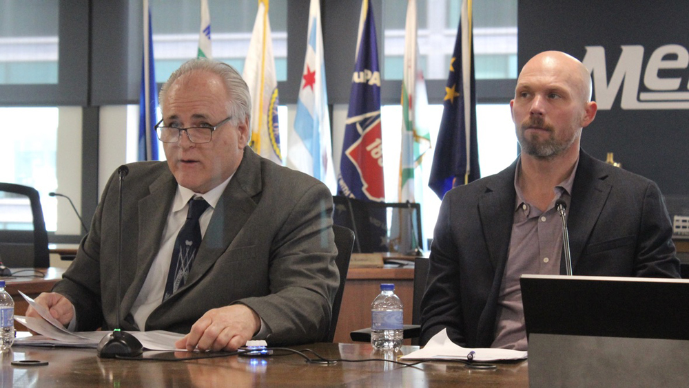 Two men at table in board room