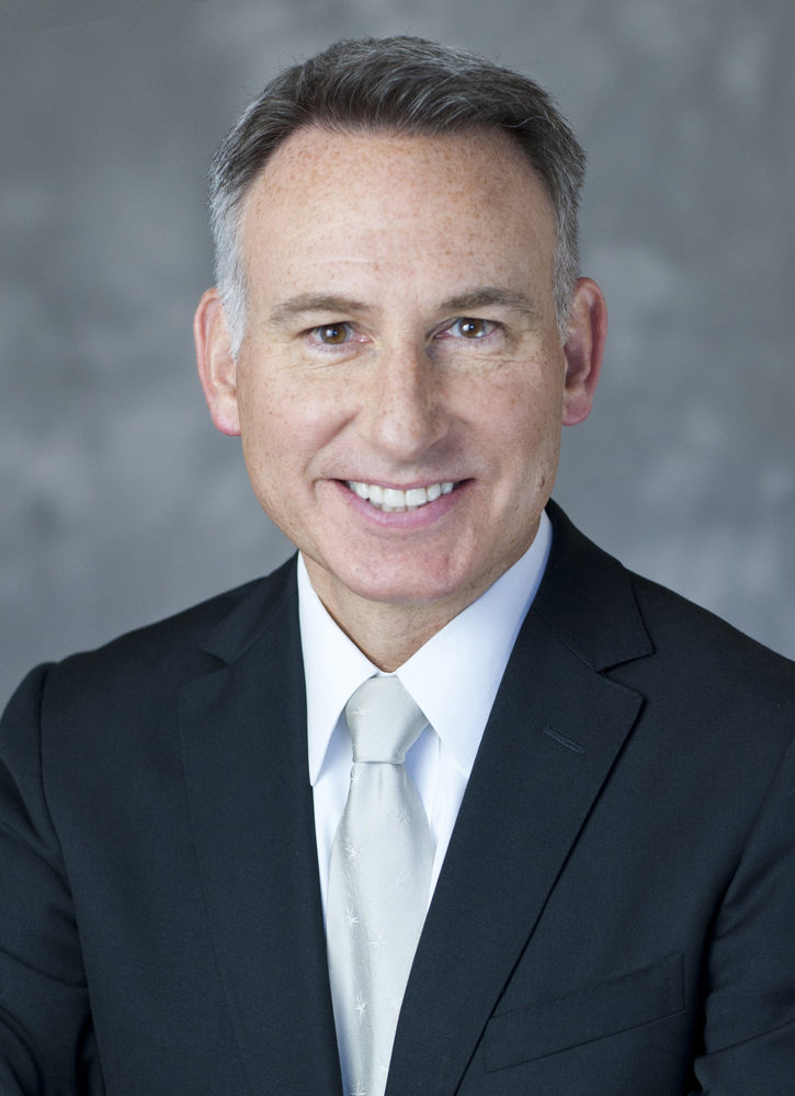 Head shot of smiling man in suit